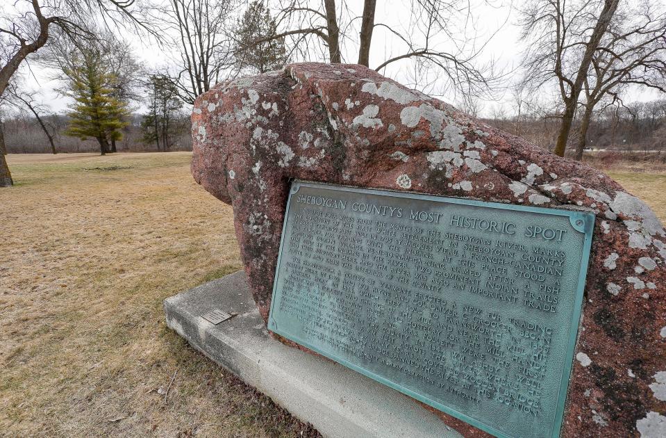 A giant boulder with a brass plaque which says that it marks the spot of the first white settlement, which was a trading post in 1795, as seen at Esslingen Park/Canoe Launch, Tuesday, March 19, 2024, in Sheboygan, Wis.