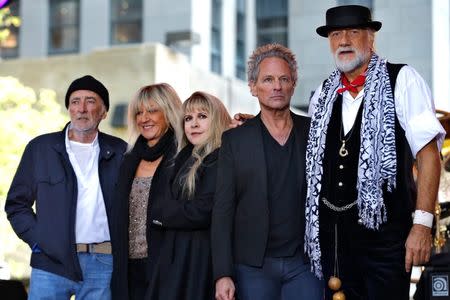 Members of the rock band Fleetwood Mac stand together on stage after performing a concert on NBC's 'Today' show in New York City, October 9, 2014. REUTERS/Mike Segar