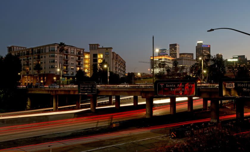 LOS ANGELES, CALIF. - SEP. 16, 2014. The Orsini, left, is a massive residential and commercial development that sits at the juncture of the Pasadena Freeway, the Harbor Freeway and Sunset Boulevard north of downtown Los Angeles. (Luis Sinco/Los Angeles Times)