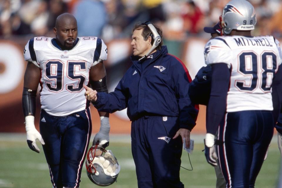 Nov 12, 2000; Cleveland, OH, USA; New England Patriots head coach Bill Belichik with Henry Thomas during the game against the Cleveland Browns at Cleveland Browns Stadium. The Browns the Patriots 19-11. Mandatory Credit: Matthew Emmons-USA TODAY Sports