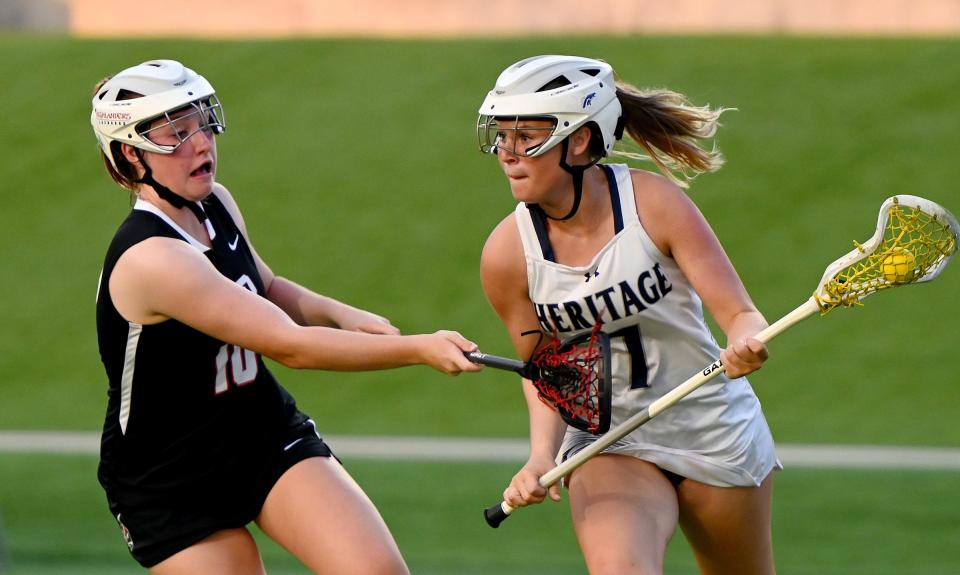 American Heritage- Delray Brooke Goldstein (7) works her.self around a Lake Highland Prep defender in a girls 1A lacrosse state championship matchup in Naples, Fla., Friday, May 6, 2023.  (Photo/Chris Tilley)