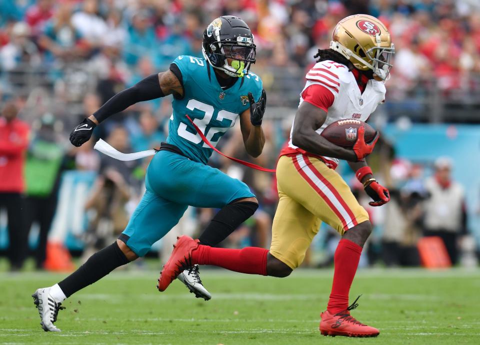 San Francisco 49ers receiver Brandon Aiyuk (11), seen here being pursued by Jacksonville Jaguars cornerback Tyson Campbell, is playing the leverage game publicly in social media by trying to get teams to do a sign-and-trade deal or convince the 49ers to sign him to a long-term contract extension.