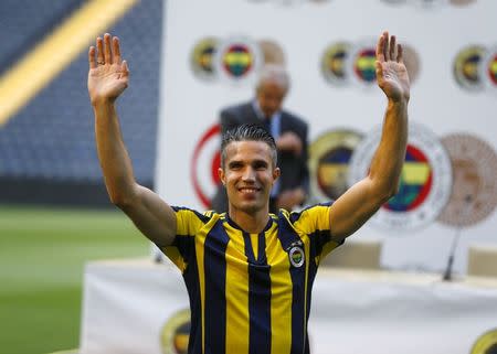 Netherlands striker Robin van Persie greets supporters during his contract-signing ceremony with Turkish club Fenerbahce at Sukru Saracoglu Stadium in Istanbul, Turkey, July 14, 2015. REUTERS/Osman Orsal