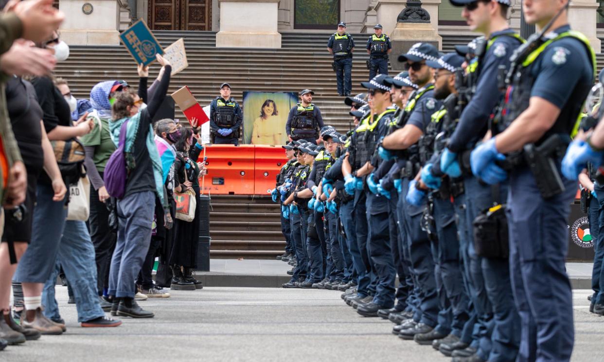 <span>A police spokesperson said it was “disappointed at the behaviour of many” of the 100 people who attended the rally at the Victorian parliament.</span><span>Photograph: Michael Currie/SOPA Images/REX/Shutterstock</span>