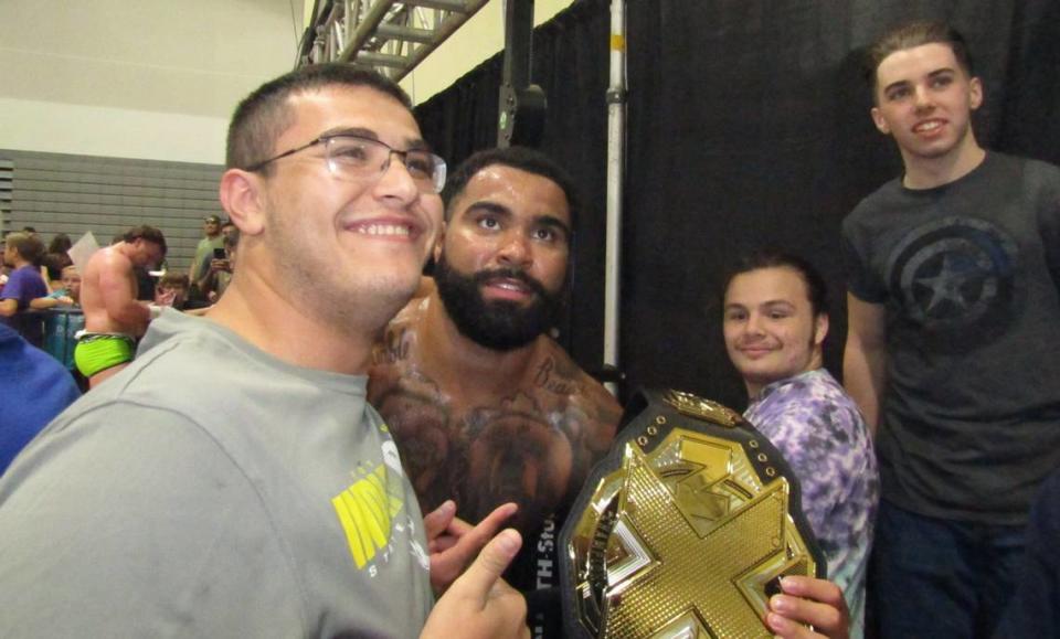 WWE NXT Superstar Gable Steveson, an Olympic gold medalist wrestler, poses for selfies with fans after an NXT Live show in September at the Havert L. Fenn Center in Fort Pierce.  