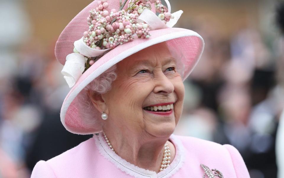 File photo dated 29/05/19 of Queen Elizabeth II meeting guests during a Royal Garden Party at Buckingham Palace in London. The Queen is set to enter the milestone 70th year of her reign, as she prepares to mark the anniversary of her accession away from Sandringham for the first time in more than 30 years. Issue date: Friday February 5, 2021. PA Photo. Elizabeth II - the nation's longest reigning monarch - will reach 69 years on the throne on February 6, meaning she is just one year away from her Platinum Jubilee. - Yui Mok/PA