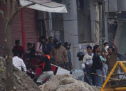 A mob vandalizes a shop during violence between two groups in New Delhi, India, Tuesday, Feb. 25, 2020. At least 23 people were killed in three days of clashes that cast a shadow over U.S. President Donald Trump's visit to the country. (AP Photo)