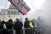 Police hold off Trump supporters who tried to break through a police barrier, Wednesday, Jan. 6, 2021, at the Capitol in Washington. (AP Photo/Julio Cortez)