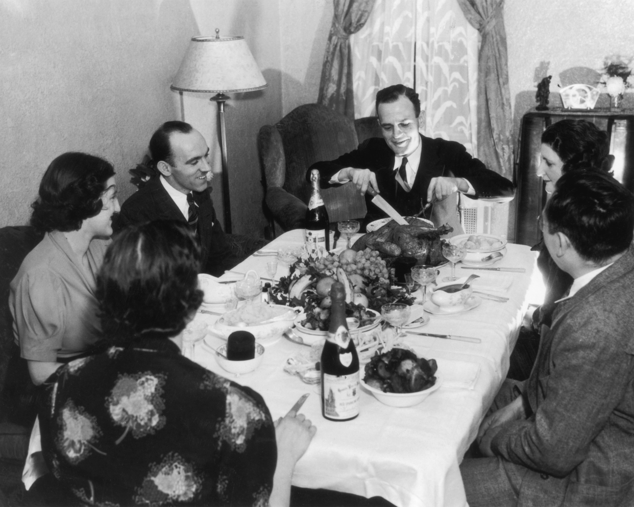 A family sit down to Thanksgiving dinner, circa 1935.