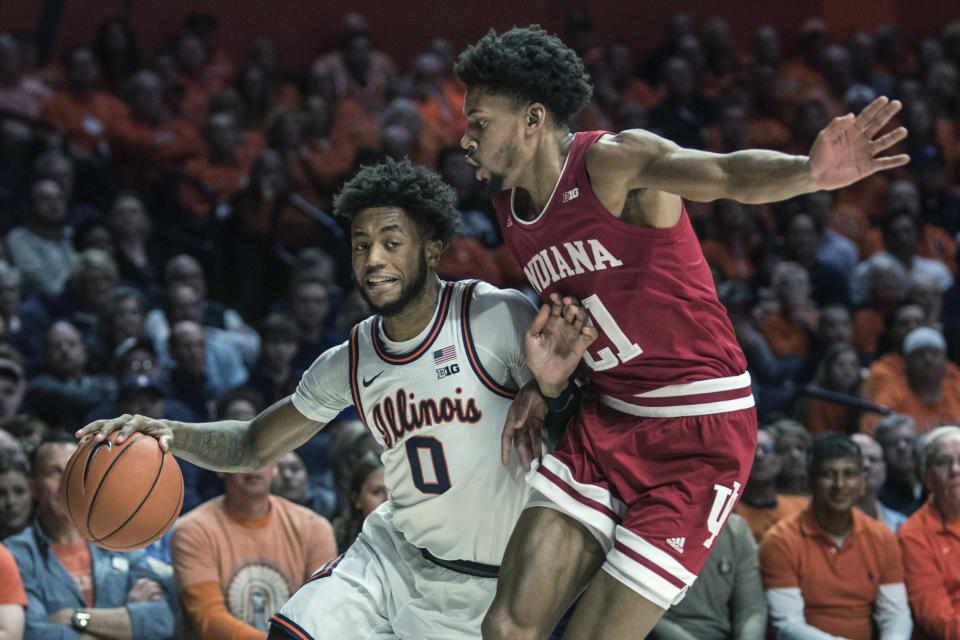 Illinois' Alan Griffin (0) drives past Indiana's Jerome Hunter (21) in the first half of an NCAA college basketball game Sunday, March 1, 2020, in Champaign, Ill. (AP Photo/Holly Hart)