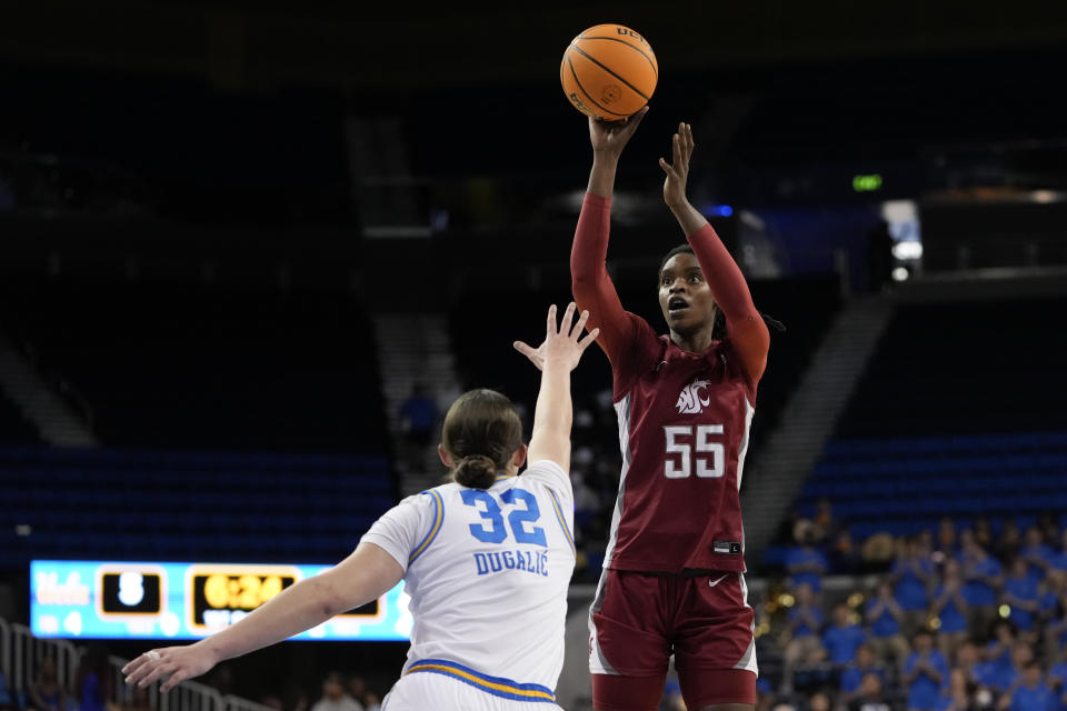 Washington State center Bella Murekatete, right, shoots against UCLA forward Angela Dugalic, left, during the first half of an NCAA college basketball game, Sunday, Jan. 28, 2024, in Los Angeles. (AP Photo/Ryan Sun)