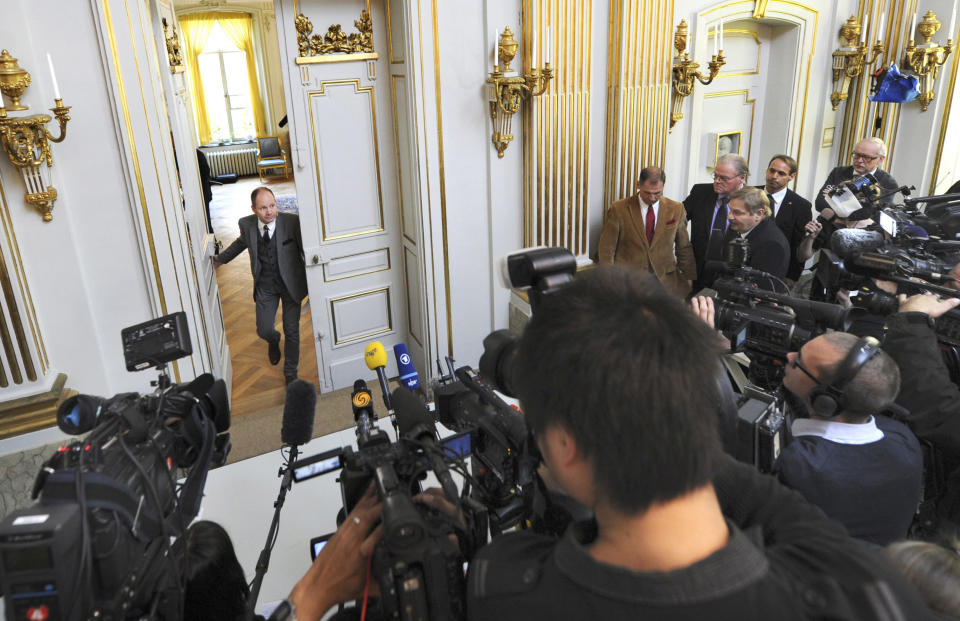 Peter Englund, permanent secretary of the Royal Swedish Academy, arrives to announce that Chinese writer Mo Yan has been named the winner of the 2012 Nobel Prize in literature, Thursday Oct. 11, 2012 in Stockholm. The Swedish Academy, which selects the winners of the prestigious award, in Thursday praised Mo's "hallucinatoric realism" saying it "merges folk tales, history and the contemporary." As with the other Nobel Prizes, the prize is worth 8 million kronor, or about $1.2 million. (AP Photo/Fredrik Sandberg) SWEDEN OUT