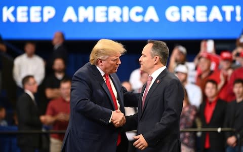 Donald Trump shakes hands with Kentucky Governor Matt Bevin the night before polls opened on his re-election bid - Credit: ANDEL NGAN/AFP via Getty Images