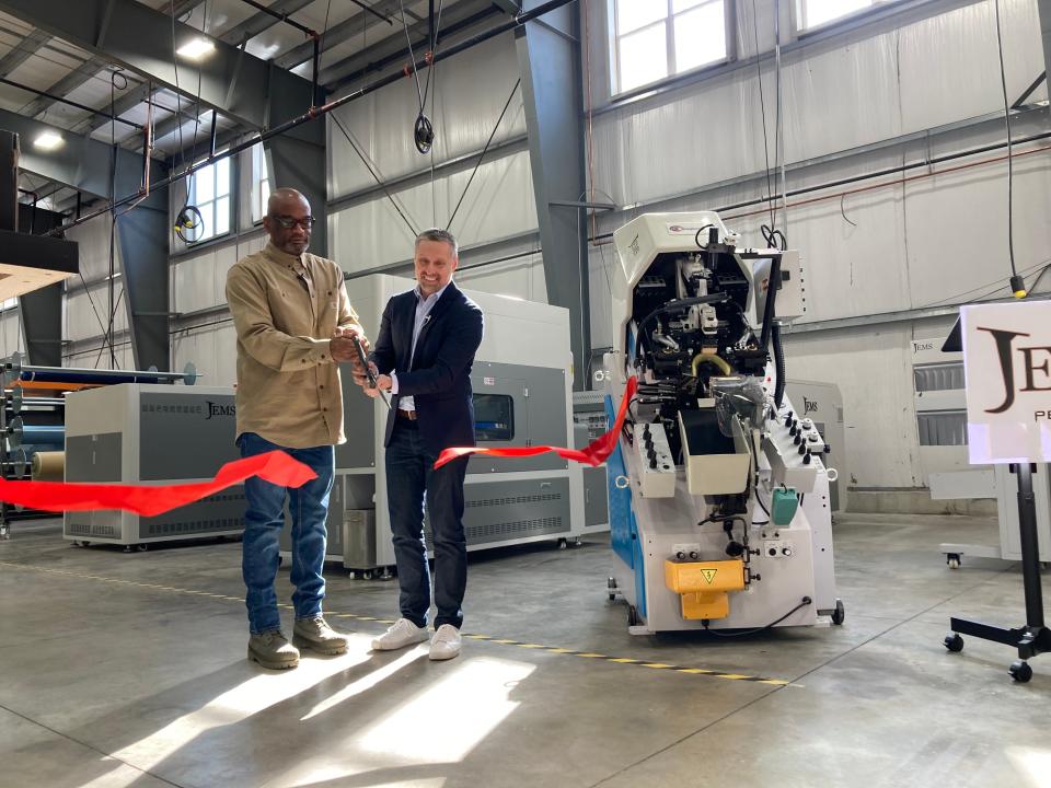 D'Wayne Edwards, a shoe designer and president of the Pensole Lewis College of Business & Design in Detroit, and Designer Brands President William Jordan cut the ribbon to mark the beginning of operations at the JEMS by Pensole shoe factory in Somersworth on Monday, March 20, 2023.