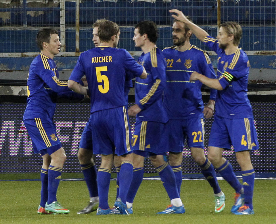 Players of Ukraine celebrates a goal against U.S. during an international friendly match at Antonis Papadopoulos stadium in southern city of Larnaca, Cyprus, Wednesday, March 5, 2014. The Ukrainians are face the United States in a friendly in Cyprus, a match moved from Kharkiv to Larnaca for security reasons. (AP Photo/Petros Karadjias)