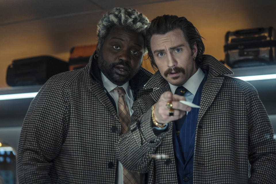 This image released by Sony Pictures shows Bryan Tyree Henry, left, and Aaron Taylor-Johnson in a scene from "Bullet Train." (Scott Garfield/Sony Pictures via AP)