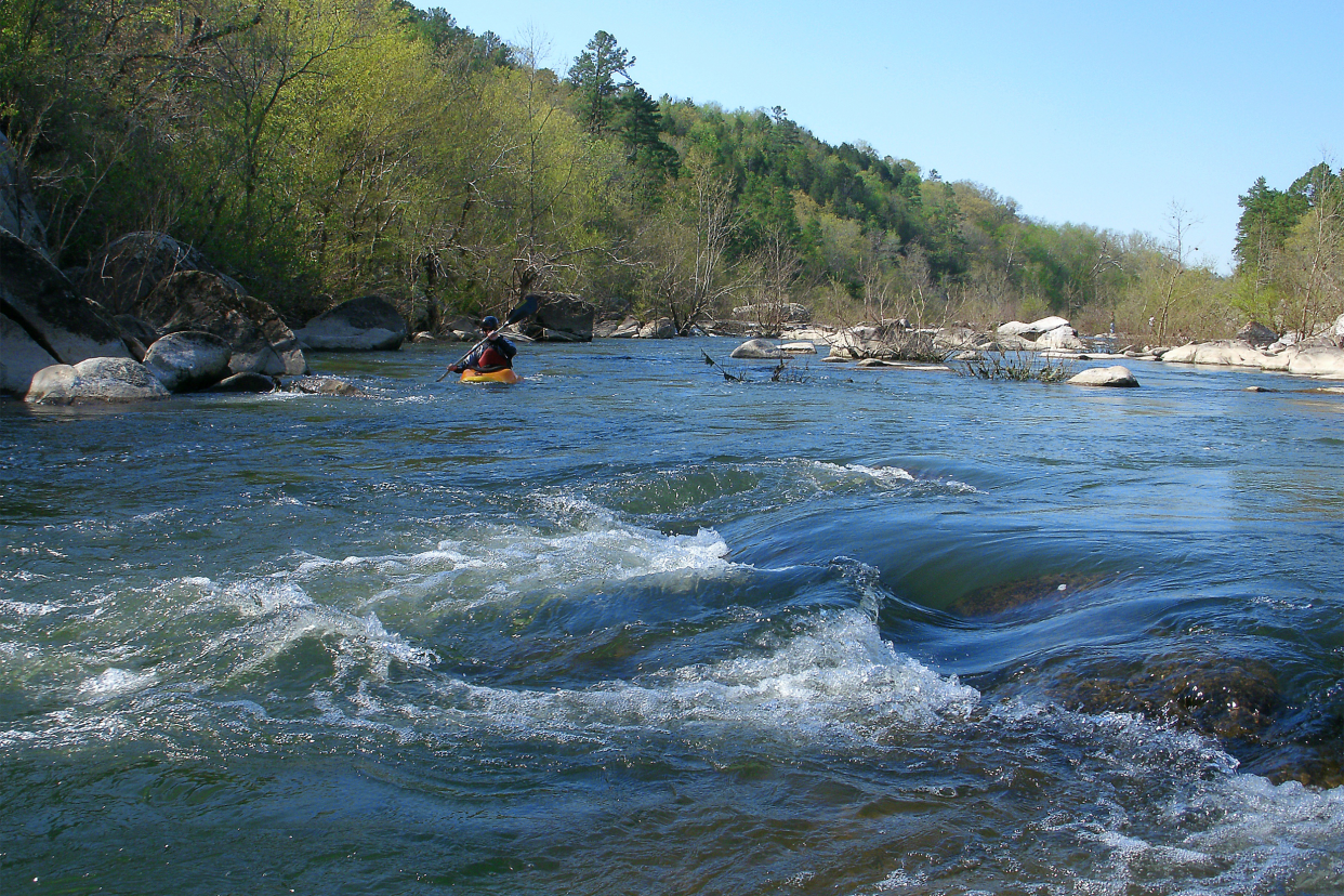 A kayaker on the St. Francis River at Silver Mines Recreation Area in the Mark Twain National Forest in Missouri.