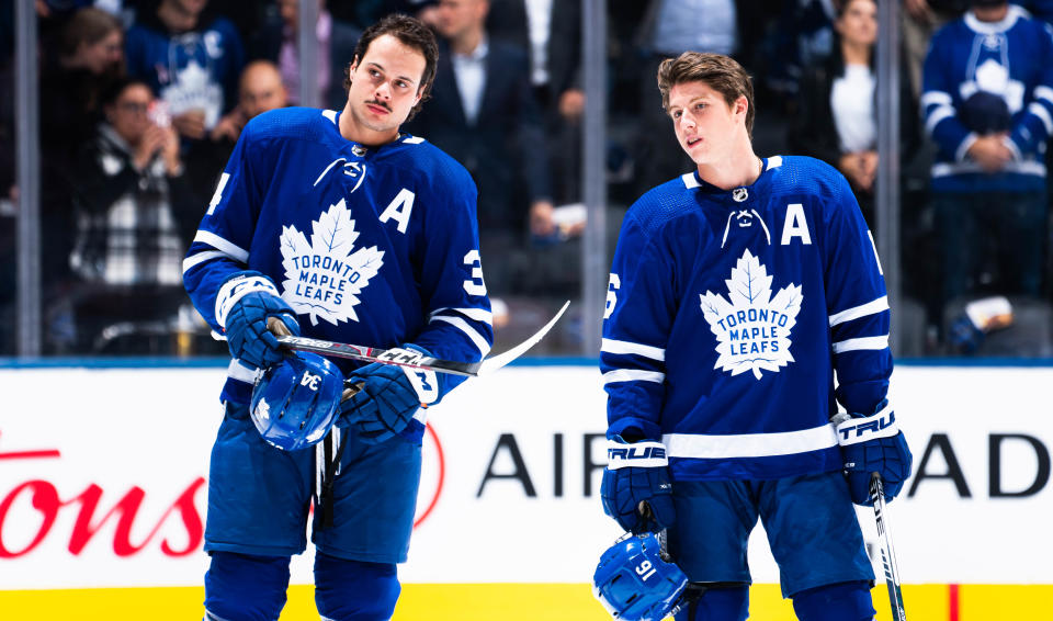 TORONTO, ON - OCTOBER 21: Auston Matthews #34 and Mitch Marner #16 of the Toronto Maple Leafs stand for the anthems before playing the Columbus Blue Jackets at the Scotiabank Arena on October 21, 2019 in Toronto, Ontario, Canada. (Photo by Mark Blinch/NHLI via Getty Images)