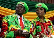 Zimbabwean President Robert Mugabe and his wife Grace attend a meeting of his ruling ZANU PF party's youth league in Harare, Zimbabwe, October 7, 2017. REUTERS/Philimon Bulawayo/Files