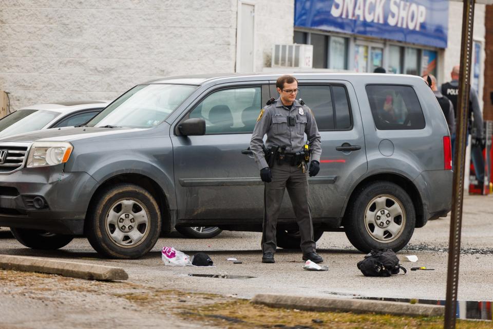 Police investigate the scene of a shooting at the Sunoco on the 400 block of Broadway, Friday, Feb. 2, 2024, in Hanover Borough.