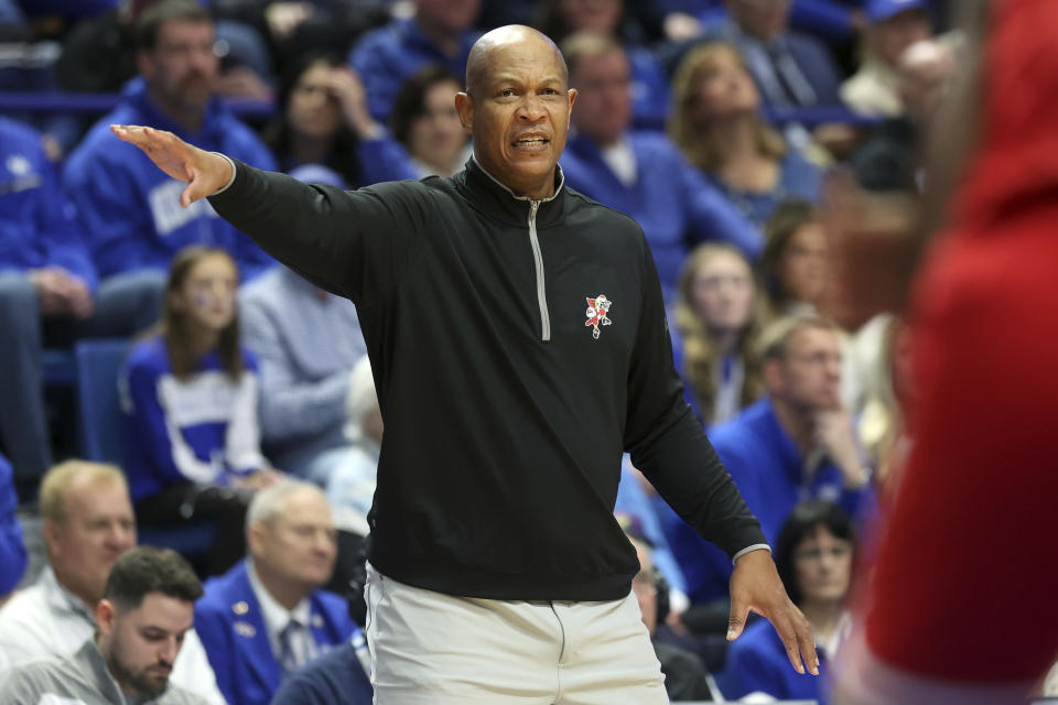 Louisville head coach Kenny Payne directs his team during the first half of an NCAA college basketball game against Kentucky in Lexington, Ky., Saturday, Dec. 31, 2022. (AP Photo/James Crisp)