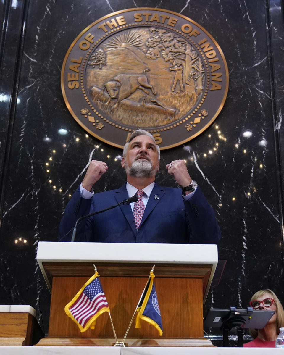 Indiana Gov. Eric Holcomb delivers his State of the State address to a joint session of the legislature at the Statehouse, Tuesday, Jan. 10, 2023, in Indianapolis. (AP Photo/Darron Cummings)