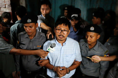 Detained Reuters journalist Wa Lone speaks to the media at a court in Yangon, Myanmar June 18, 2018. REUTERS/Ann Wang