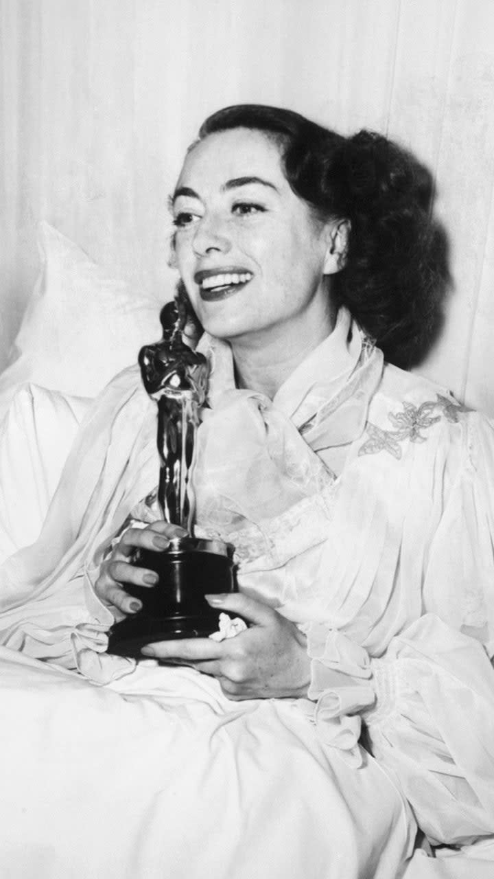 Joan Crawford Holding Academy Award