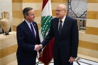 Britain's Foreign Secretary David Cameron, left, shake hands with Lebanese caretaker Prime Minister Najib Mikati in Beirut, Lebanon, Thursday, Feb. 1, 2024. Cameron discussed with Lebanese officials the volatile situation in the Middle East during a stop in Beirut part of a regional tour. (AP Photo/Bilal Hussein)