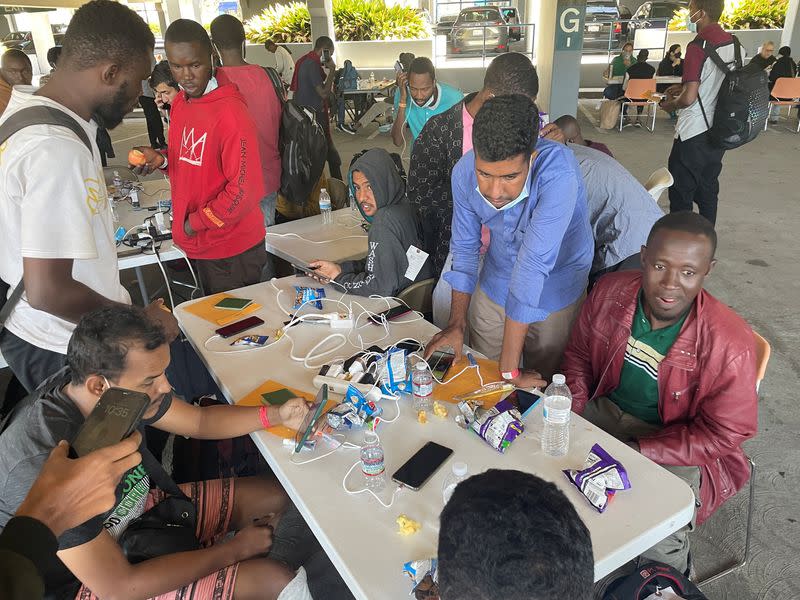 Oceanside City Councilman Eric Joyce helps orient asylum-seekers who have just been released