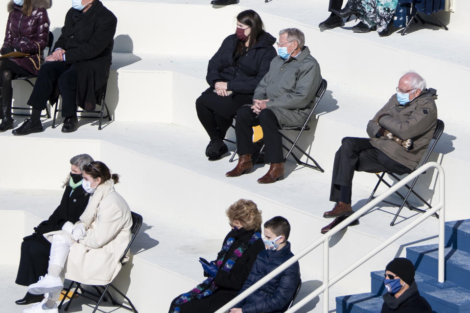 Attendees including Sen. Bernie Sanders, I-Vt., listen during the 59th Presidential Inauguration at the U.S. Capitol in Washington, Wednesday, Jan. 20, 2021. (Caroline Brehman/Pool via AP)