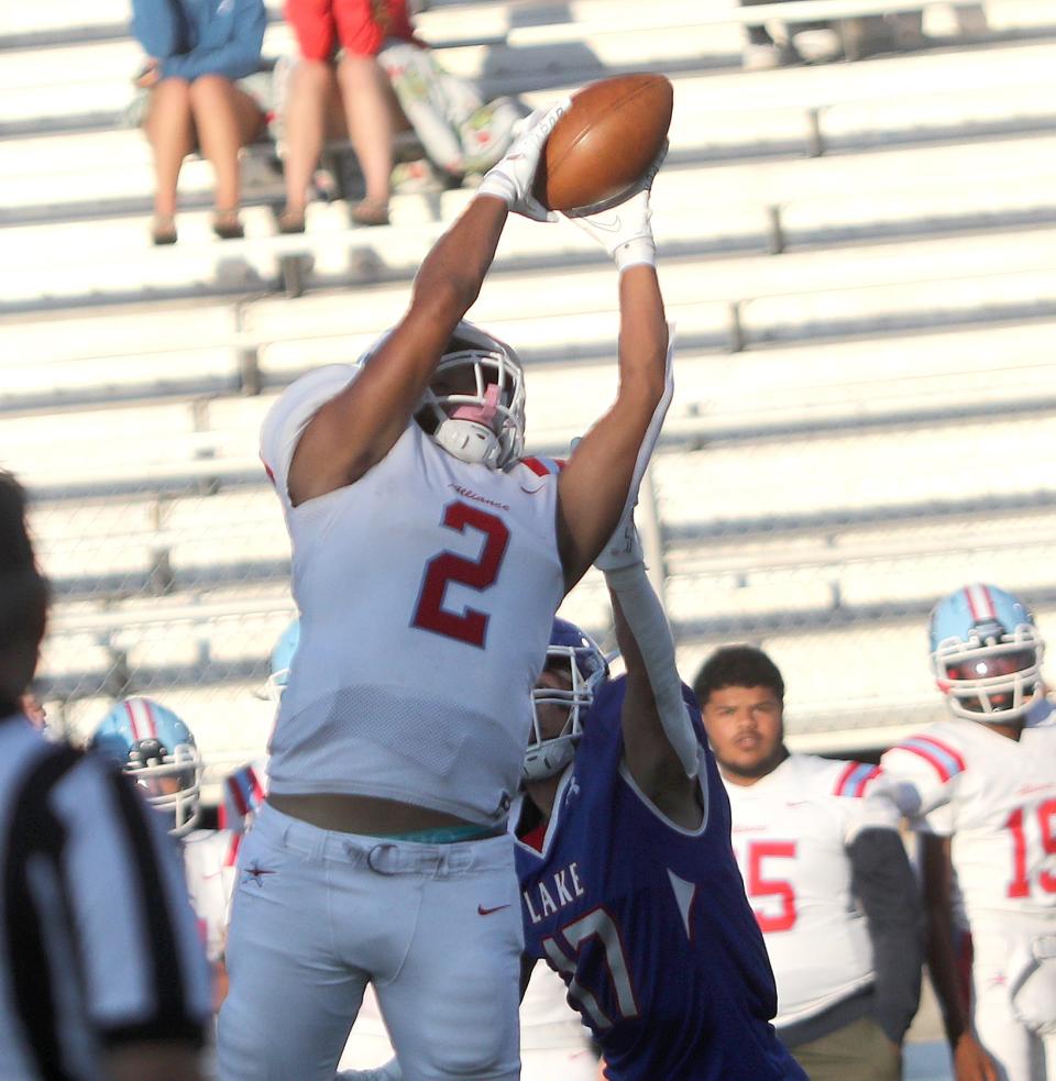 Alliance's K'Vaughn Davis (2) pulls in a pass defended by Lake's Celton Dutton, Friday, Aug. 18, 2023.