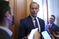 Senate Minority Whip John Thune, R-S.D., talks to reporters outside his office as the Senate works to advance the $1 trillion bipartisan infrastructure bill, at the Capitol in Washington, Monday, Aug. 2, 2021. The 2,700-page bill includes new expenditures on roads, bridges, water pipes broadband and other projects, plus cyber security. (AP Photo/J. Scott Applewhite)