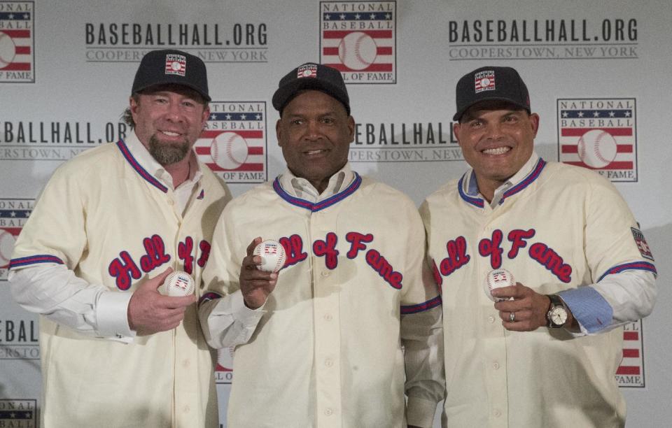 Newly elected baseball Hall of Fame inductees Jeff Bagwell, left, Tim Raines, center, and Ivan Rodriguez, poses for a photo during a news conference, Thursday, Jan. 19, 2017, in New York. (AP Photo/Mary Altaffer)