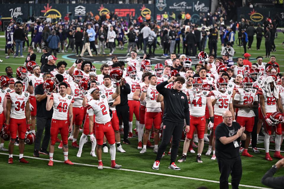 Utah Utes players and coaches sing their fight song after losing the Northwestern in the SRS Distribution Las Vegas Bowl at Allegiant Stadium on Saturday, Dec. 23, 2023. Northwestern won 14-7. | Scott G Winterton, Deseret News