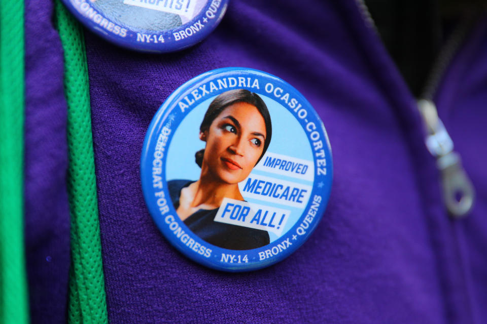 A man attending the Women’s March wears a button of newly elected Rep. Alexandria Ocasio-Cortez, D-N.Y. (Photo: Gordon Donovan/Yahoo News)