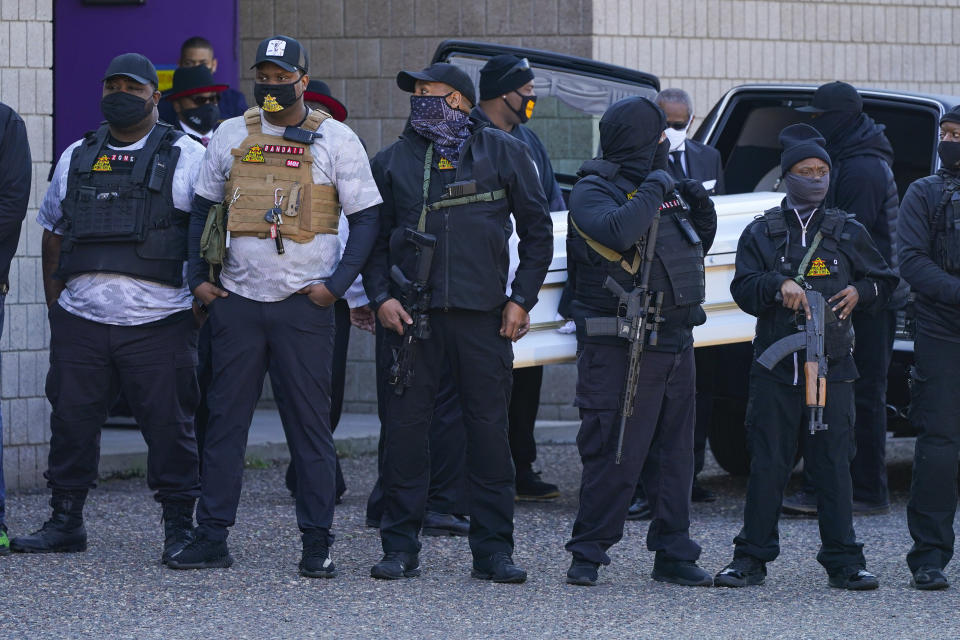 Daunte Wright's casket is removed from the hearse for funeral services behind an escort of the Minnesota Freedom Fighters at Shiloh Temple International Ministries in Minneapolis, Thursday, April 22, 2021. The 20-year-old Wright was killed by then-Brooklyn Center police officer Kim Potter during a traffic stop on April 11. (AP Photo/Julio Cortez)