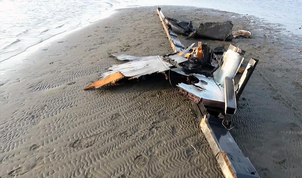 In this handout image provided by the Houthi media center, wreckage of an alleged US drone which Yemen's Houthi group forces claim they shot down lies on the ground on Feb. 20, 2024 in Alhudaydah province, Yemen.