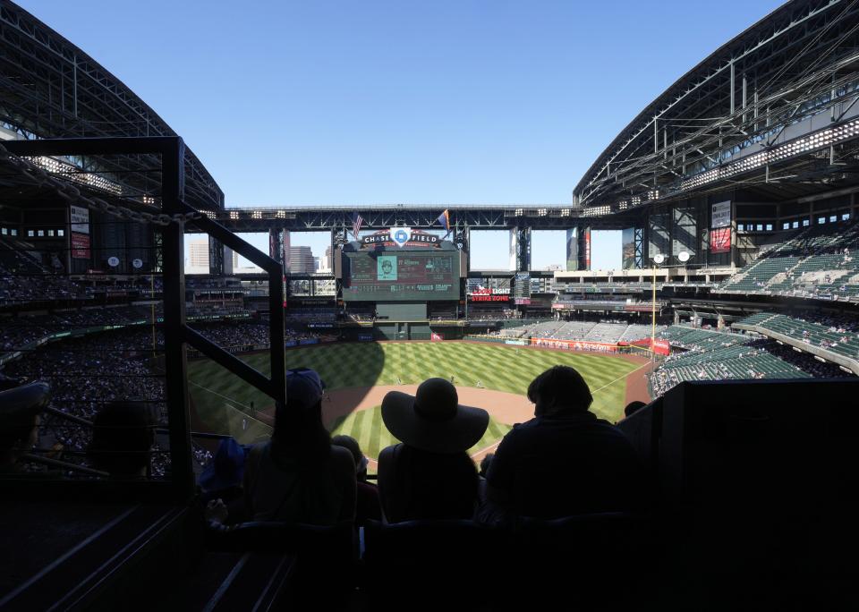 Fans watch the Arizona Diamondbacks and the Los Angeles Dodgers play with the roof opened at Chase field during the seventh inning in Phoenix on April 9, 2023.