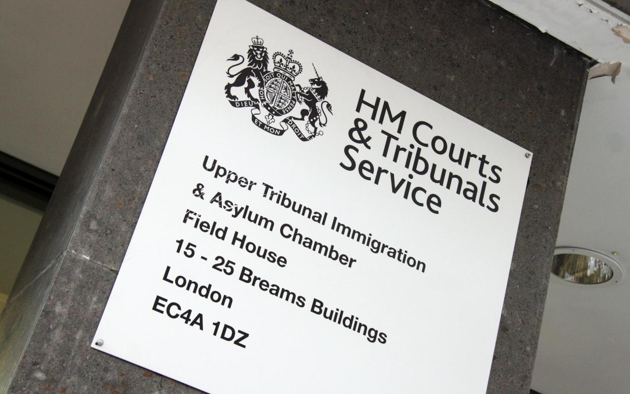 A sign for HM Courts & Tribunals Service in London