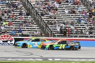 William Byron (24) and Austin Dillon (3) compete for position down the front stretch during the NASCAR Cup Series All-Star auto race at Texas Motor Speedway in Fort Worth, Texas, Sunday, June 13, 2021. (AP Photo/Larry Papke)