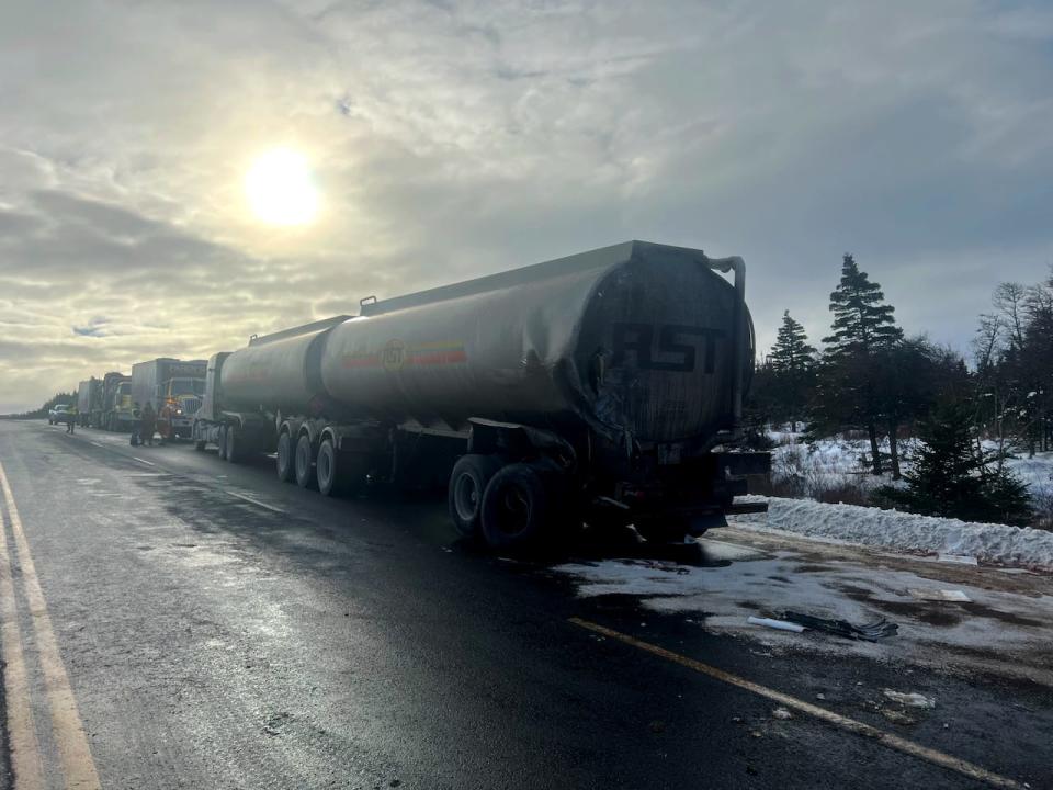 The RCMP in Whitbourne have closed a section of the Trans-Canada Highway due to a collision in which a large amount of fuel was spilled on the highway (Submitted by Tulk's Towing - image credit)