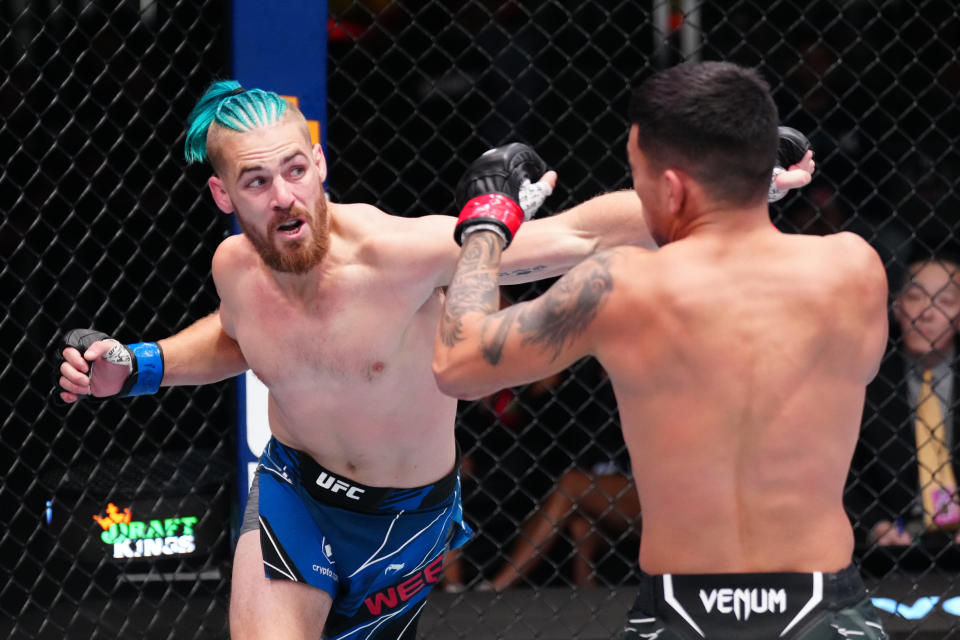 LAS VEGAS, NEVADA – OCTOBER 29: (L-R) Joshua Weems punches Christian Rodriguez in a bantamweight fight during the UFC Fight Night event at UFC APEX on October 29, 2022 in Las Vegas, Nevada. (Photo by Jeff Bottari/Zuffa LLC)