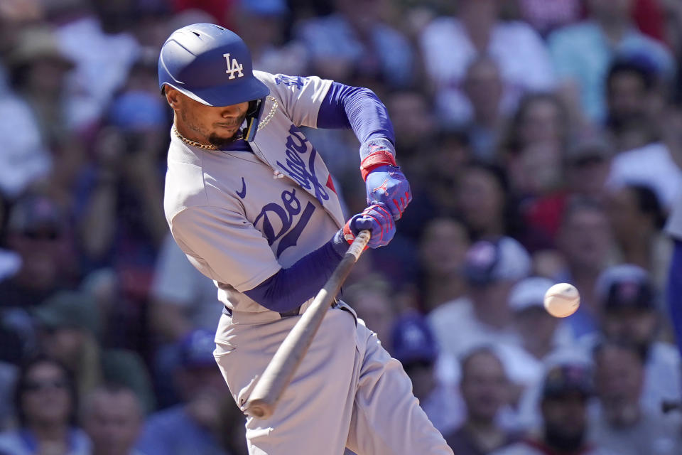 Los Angeles Dodgers' Mookie Betts hits a two-run home run in the sixth inning of a baseball game against the Boston Red Sox, Sunday, Aug. 27, 2023, in Boston. (AP Photo/Steven Senne)