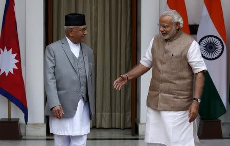 Prime Minister Narendra Modi (R) gestures as his Nepali counterpart Khadga Prasad Sharma Oli looks on during a photo opportunity ahead of their meeting at Hyderabad House in New Delhi, India, February 20, 2016. REUTERS/Adnan Abidi