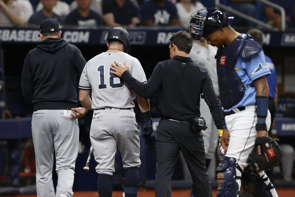 New York Yankees' Andrew Benintendi, who was batting, leaves the team's baseball game against the Tampa Bay Rays during the third inning Friday, Sept. 2, 2022, in St. Petersburg, Fla. (AP Photo/Scott Audette)