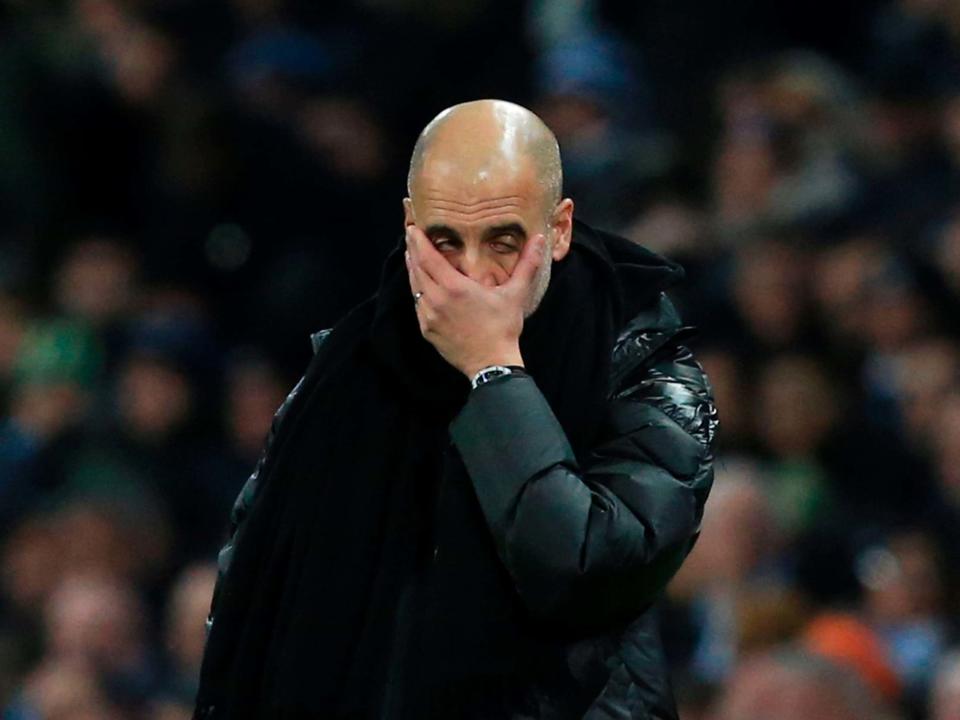 Pep Guardiola reacts to Manchester City's 2-1 defeat by rivals Manchester United: Getty