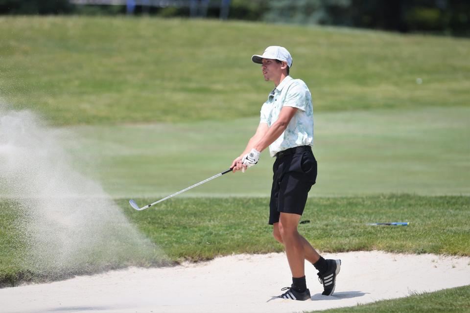 Yorktown senior Ethan Darby hits his ball out of the 18th-hole bunker in the IHSAA Muncie Central boys golf regional tournament at The Players Club on Thursday, June 8, 2023.