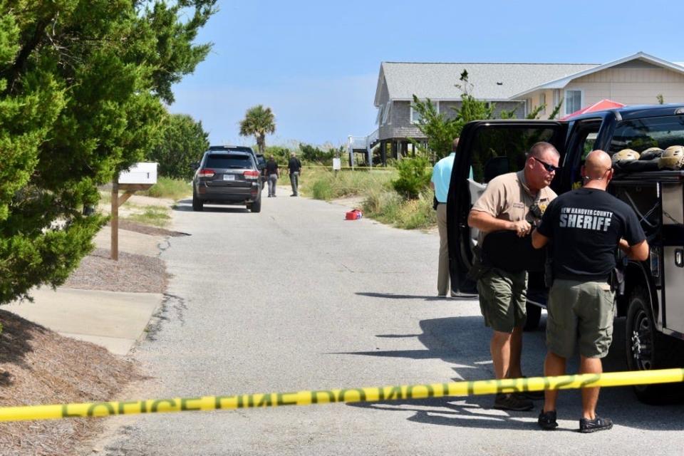Law enforcement with the Wilmington Police Department and New Hanover County Sheriff’s Office on the scene at the intersection of North Lumina Drive and Scotch Bonnet Lane in Wrightsville Beach Friday, Aug. 18.