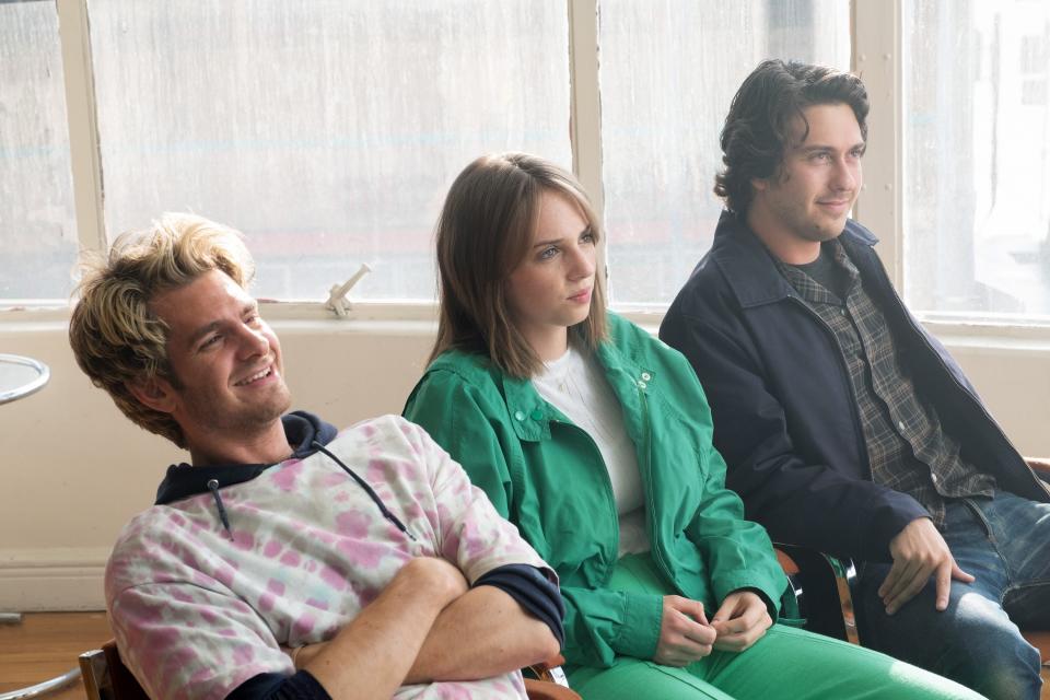 Andrew Garfield, Maya Hawke, and Nat Wolff sit in chairs